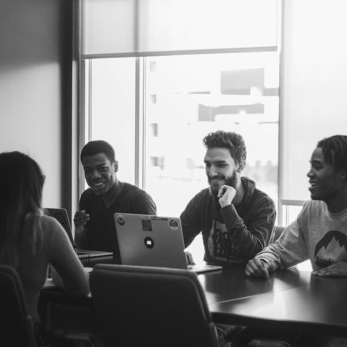 students at conference table