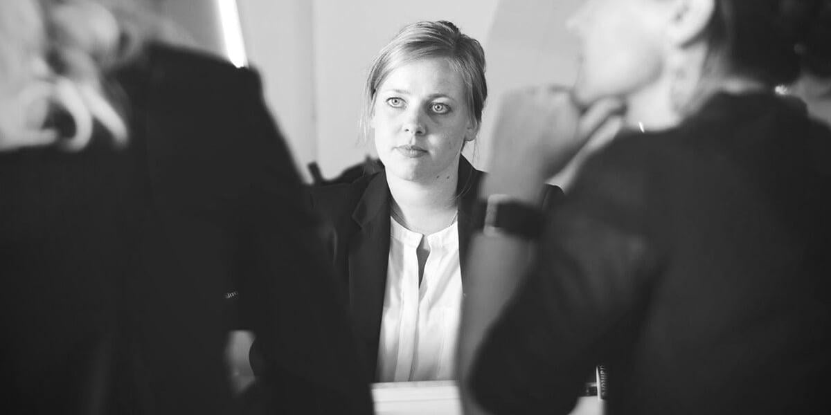 student in a meeting, actively listening