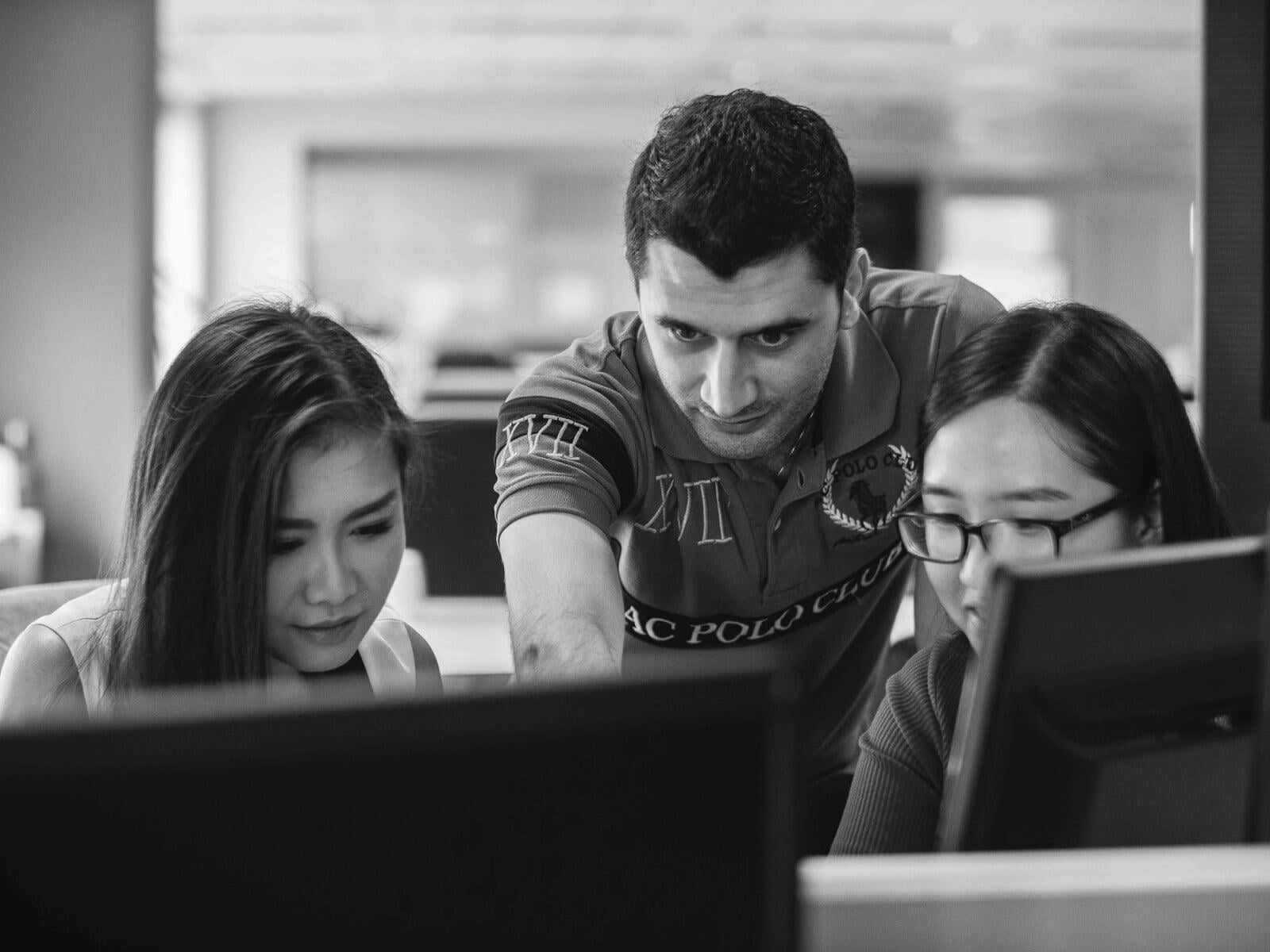 three students working in computer lab